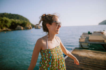 Happy young woman at the beachの写真素材