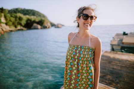 Happy young woman at the beachの写真素材