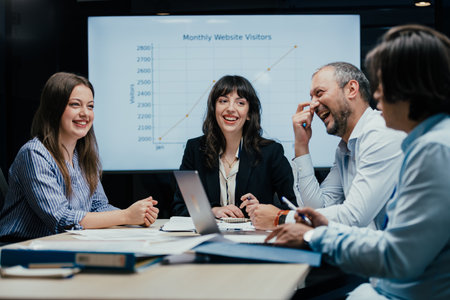 Fun and a laugh at a business meeting in luxury office boardroom