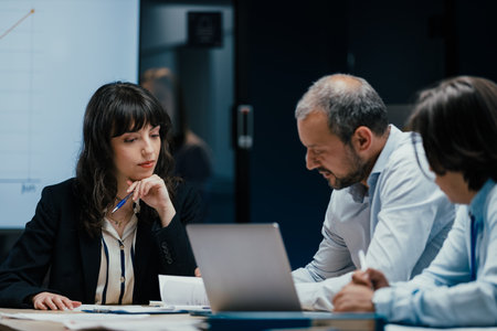 Colleagues listening attentively to opinion during business meeting in office