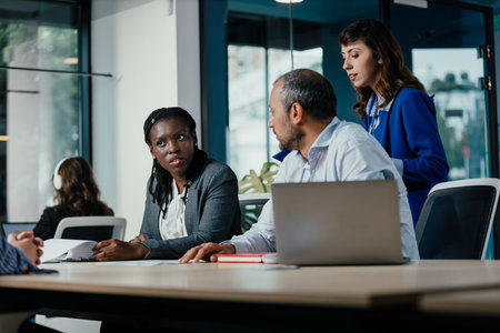 Multicultural business people collaborating during office meeting