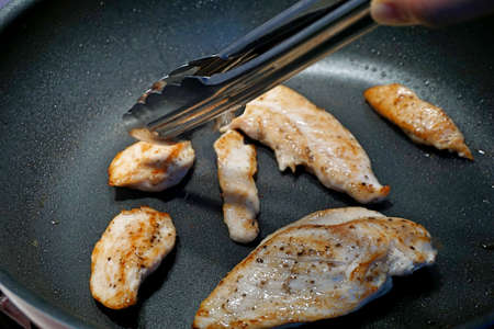 Home made pan fry chicken breast marinated with salt and pepper.の写真素材