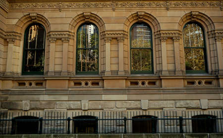 green frame window of cathedral behind the green fence,pattern of green frame Cathedral windows backgroundの写真素材