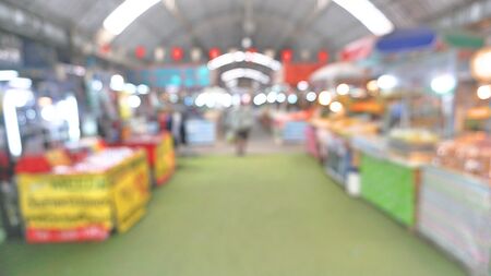 Blur of fresh market with people walking and shopping background. Blur background of fresh vegetable, meat, and fruit at indoor market.の写真素材