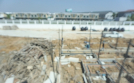 Blur background of home construction site in Thailand. Land development concept. Image of piling work for house base.の写真素材