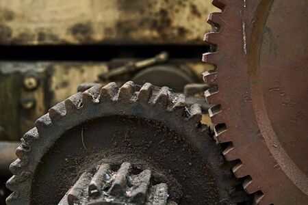 Grain Image: Close up of old machine factory made of steel and used in the past. Broken and rustic...