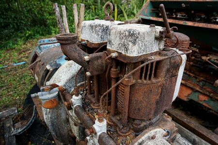 Grain Image: Close up of old machine factory made of steel and used in the past. Broken and rustic machine left over in abandon factory. Image of aged equipment with rust and gear part.の写真素材