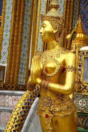 Welcome whit statue Kinnari at Wat Phra Kaew in Bangkok, Thailand.の写真素材