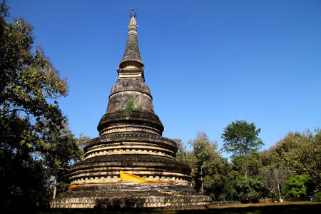 Old pagoda in forest and blue sky at county Chiang Mai, Thailand