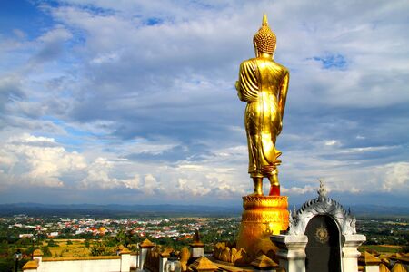 Buddha standing on mountain look cloud and the rain at Wat Phra That Khao Noi, Nan Province, Thailandの写真素材