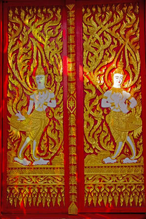 The door with tracery Thai Lanna at Wat Don keaw of Nan, Thailandの写真素材