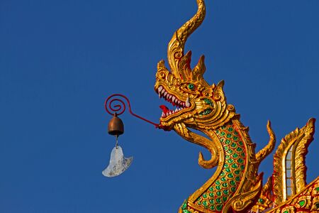Statue heat dragon and small bell at Wat Donkeaw of Nan, Thailandの写真素材