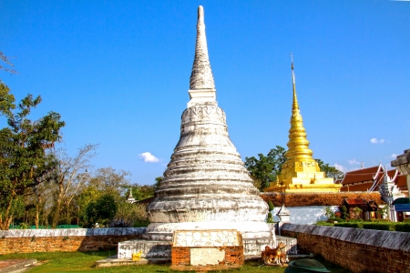  Ancien pagoda with gold pagoda at Wat Phra That Chae Haeng, Nan province, Thailandの写真素材