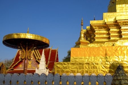 Gold architecture with old wall  at Wat Phra That Chae Haeng, Nan province, Thailandの写真素材