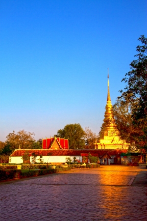 Gold architecture and shurch with  sky at Wat Phra That Chae Haeng, Nan province, Thailandの写真素材