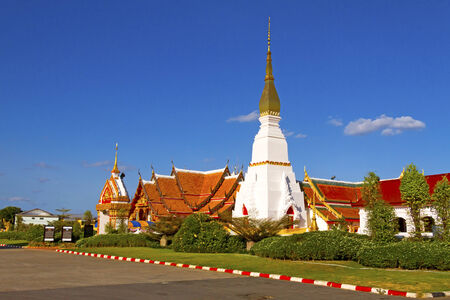 Idyllic white Wat Pra That Choeng Chum Worawihal temple with sky ,Sakon Nakhon Province , northeastern of Thailand.の写真素材