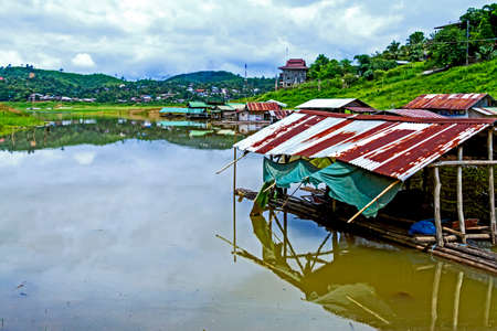 Old hut on lake after rains at sangklaburi, kanchanaburi, Province Asia thailandの写真素材