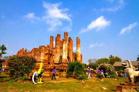 Traveler and ancient architecture at Wat Thummikarat  temple, Ayutthaya, Thailandの写真素材