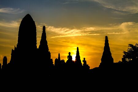 Silhouette old stature with sunset at Wat Chaiwattanaram temple , Ayutthaya, Thailandの写真素材