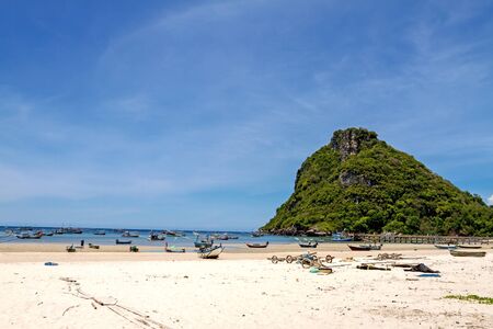 Group fishing boat and mountain at Tham Thong Beach Chumphon Provice, Thailandの写真素材