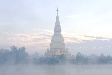 Sharp pagoda gold with steam at Wat  Phra That hau tom, Lamphun Province,Thailand