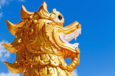 Sculpture dragon with blue sky at Wat Pra That Choeng Chum, Sakon Nakhon Thailandlndの写真素材