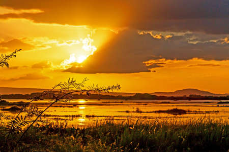 Beautiful sunset on river in countryside, Sakon Nakhon Thailandalndの写真素材