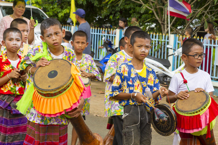 SISAKET,THAILAND. On October 1, 2016, in rural northeastern province of Sisaket, Boy play and dancing in traditional Sart Thai. SART THAI  is an important tradition of rural Thailand.のeditorial素材