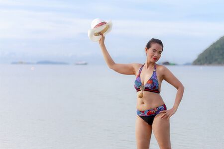 Bikini with women body sexy symbol hat and sunglasses on Thung Wua Lan Beach, at Chumphon Province Thailandの写真素材