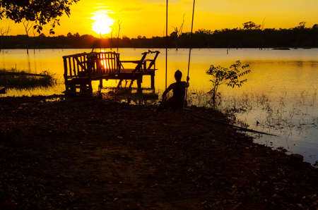 Sunset and black shadow in lagoon at Mukdahan national park county of,Thailandの写真素材