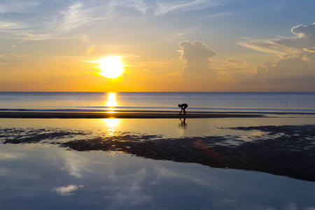 Sunrise and travealer at beach Ban Krut Beach, in Prachap Kirikhun Province Thailand is famous for travelの写真素材