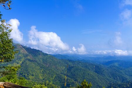 Green forest and sky beautiful with mountain and rainforest in Kanchanaburi province, Thailand