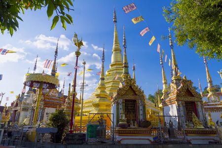 Architecture gold beautiful with sunshine and blue sky at Wat Phra Bat Ban Tak, Tak Province, of...