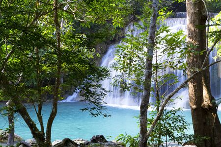 Waterfall the Erawan Waterfall is water emerald in green forest and is rain forest of Kanchanaburi province, Thailandの写真素材