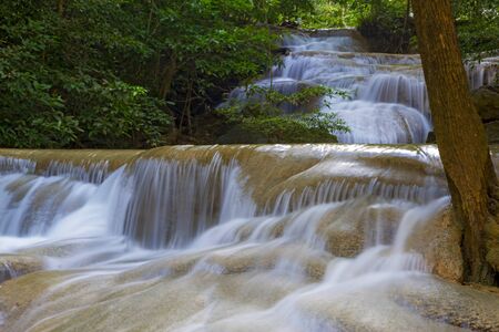 Waterfall the Erawan Waterfall is famous Kanchanaburi province Thailand, It is in green forest and rain forest.の写真素材