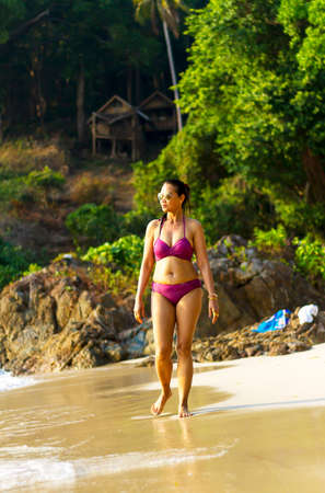 Woman traveler in bikini walk on beach at beach Koh Chang Thailand.
Koh Chang is located in the eastern Gulf of Thailand. It is an island with beautiful nature. Famous for tourismの写真素材