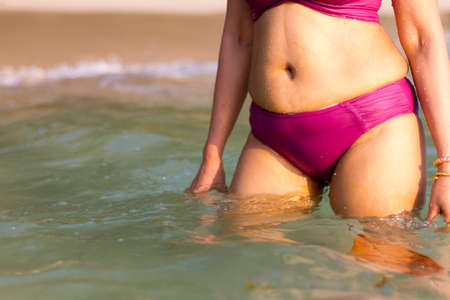 woman shape big sexy with sunshine at beach Koh Chang Thailand.Koh Chang is located in the eastern...