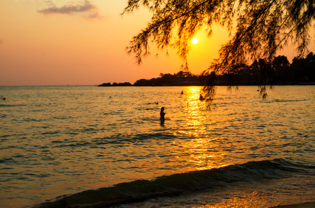 Sunset with black shadow of traveler at beach Koh Chang Thailand.の写真素材