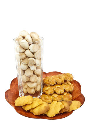 thai sweetmeat made of flour and nut cookies on wooden plateの写真素材