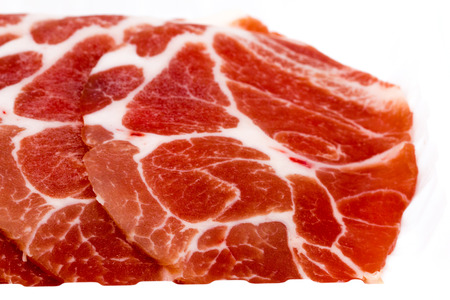 Close-up sliced raw pork isolated on white background. It copy space and selection focus.