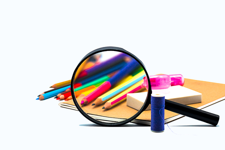 Books ,pen,pencil,Magnifying glass and office equipment on board background, education and back to school conceptの写真素材