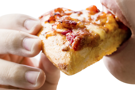 Hand hold and eat Pizza box set isolated on white background.Closed up.の写真素材