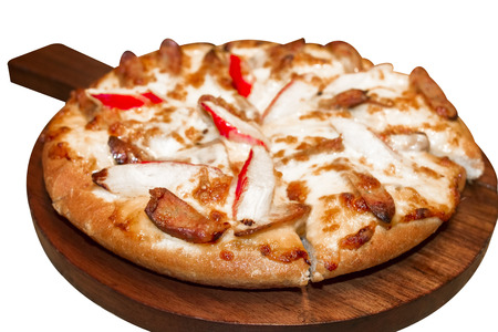 Fast food italian traditional.Hot chicken sausage pizza with cheese, imitation crab stick on wooden board table classic in top view.Closed up.Copy space.の写真素材