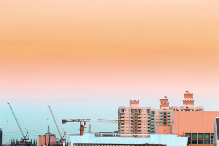 Bird view over cityscape with sun and clouds in the morning.Copy space.Bangkok.Pastel tone.の写真素材