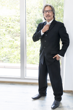 Business senior old man smile and excitement in office working .Copy space.の写真素材