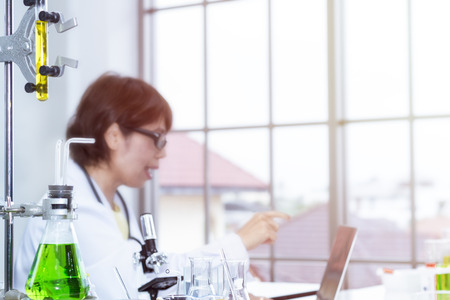 Beautiful senior female doctor researching work at laboratory.Copy space.の写真素材