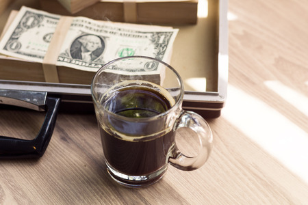 Fresh homemade black coffee and dollar in breakfast.Copy space.の写真素材