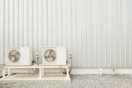 air-conditioner fan and Wall steel metal plate texture backgroundの写真素材