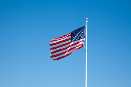 American flag with blue sky for Memorial Day or 4th of July.の写真素材
