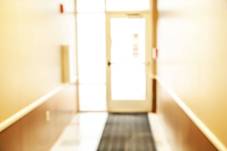 Blurred abstract background interior view inside empty and entrance doors. Blurry perspective...